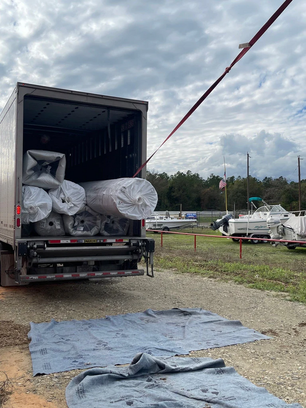 Unloading Athletic Turf from Freight Truck